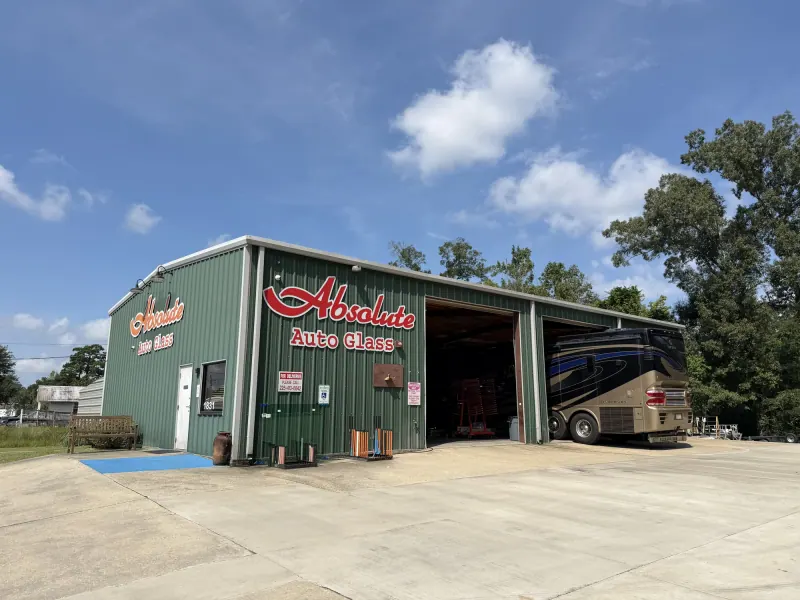 Absolute Auto Glass building in Denham Springs with a motorhome in the service bay